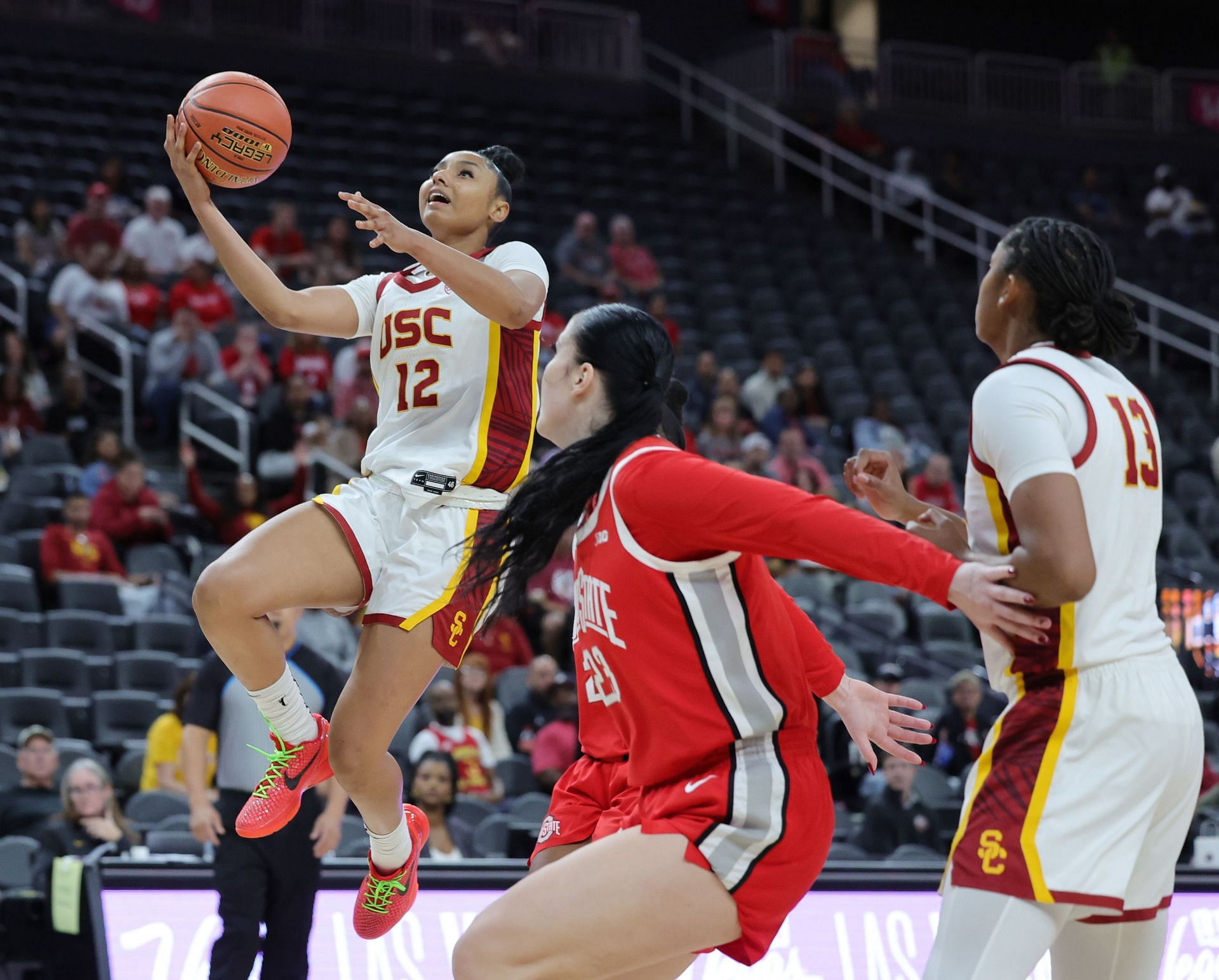 JuJu Watkins #12 of the USC Trojans drives to the basket.